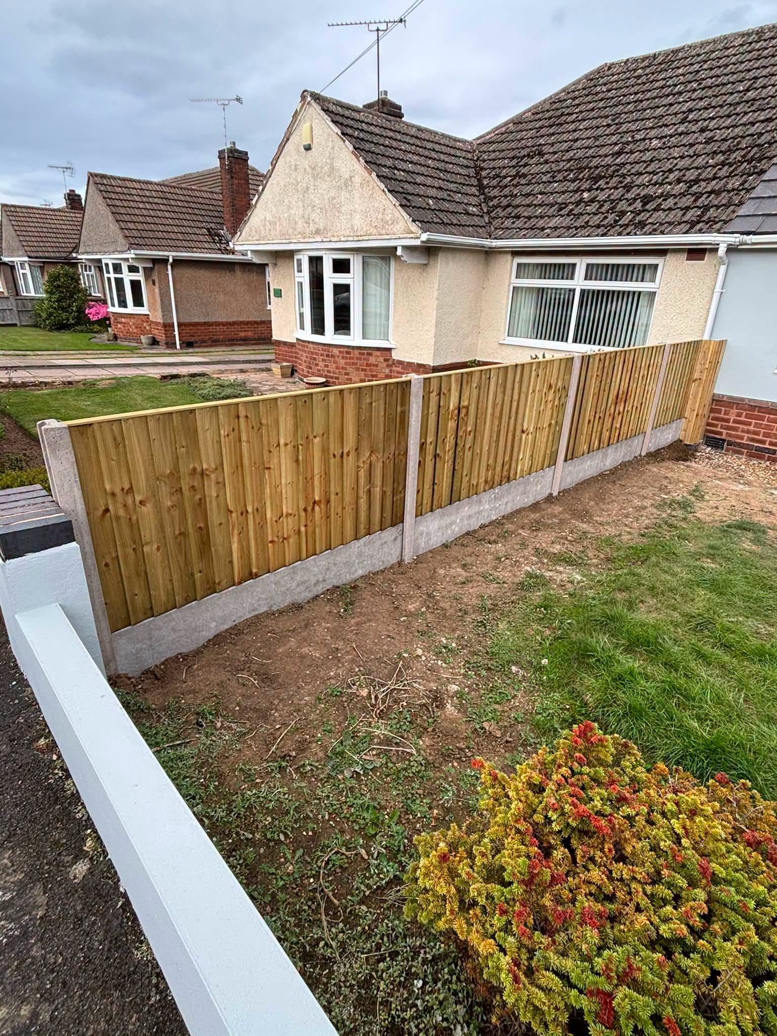 New featheredge fence on concrete gravel boards